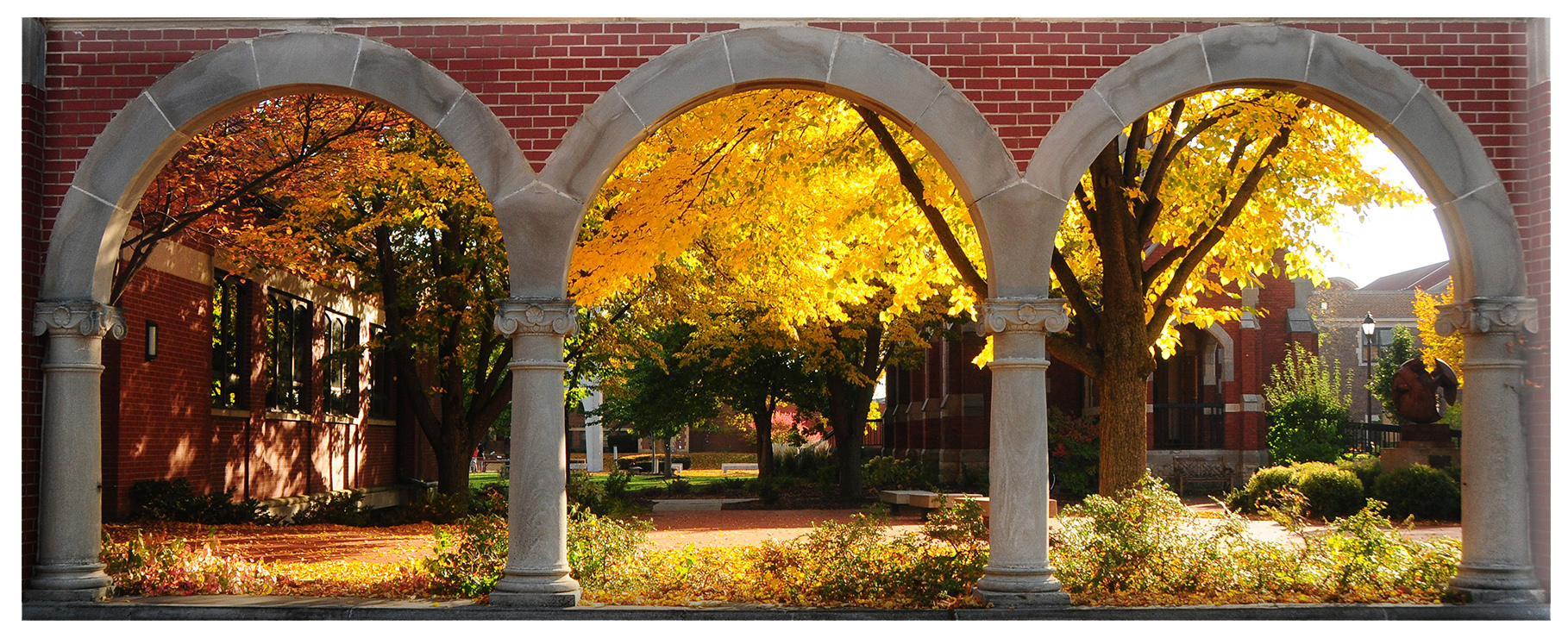 Brick and stone arches of Alumni Courtyard at University of Dubuque