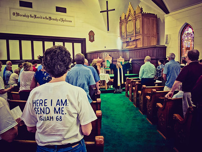 Students worshipping in a local church sanctuary